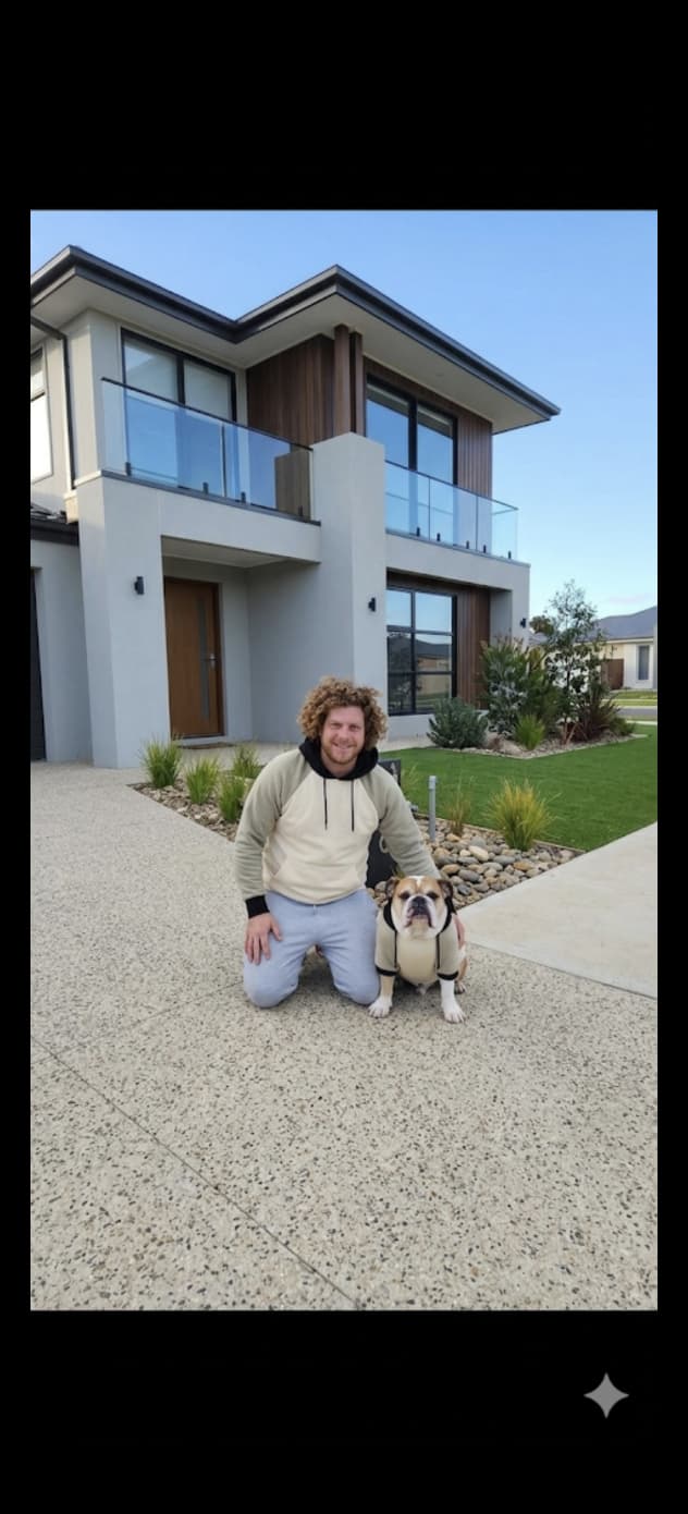Nathan and Mac out the front of a finished Born to Build home